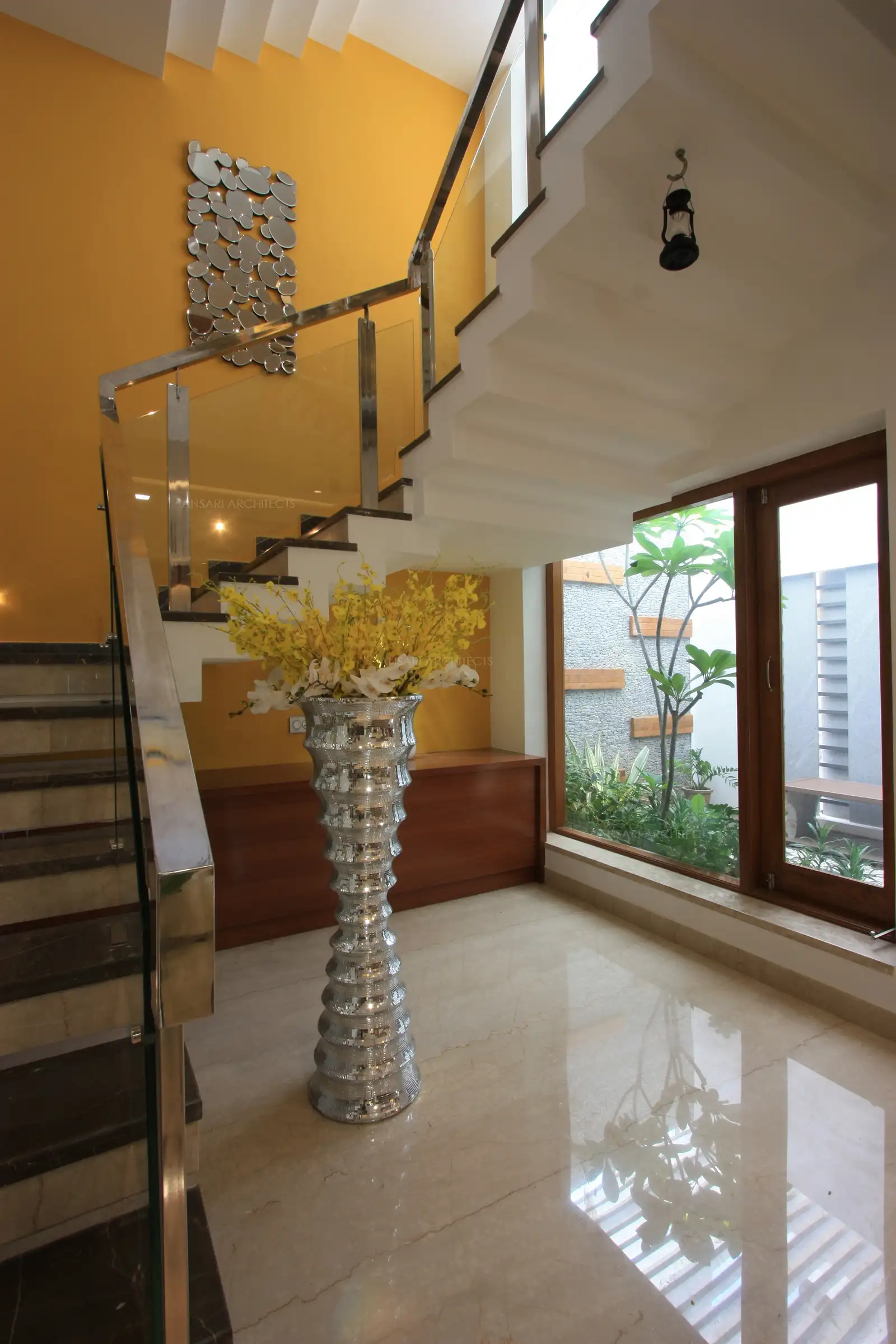 Hand picked accessories and wall hangings turn into a focal point in this staircase area.
