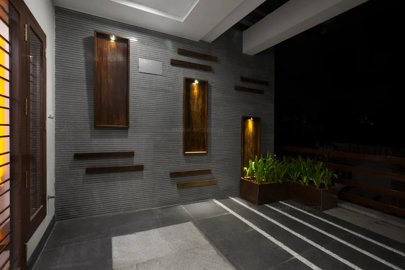 North facing spacious balcony with sleek wall cladding and wooden railings.