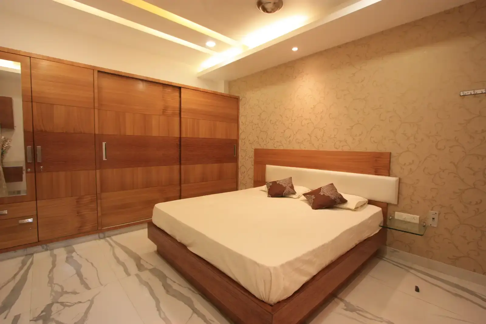 Bedroom-1 is designed with a simple bed and wardrobe with ample amount of starage.