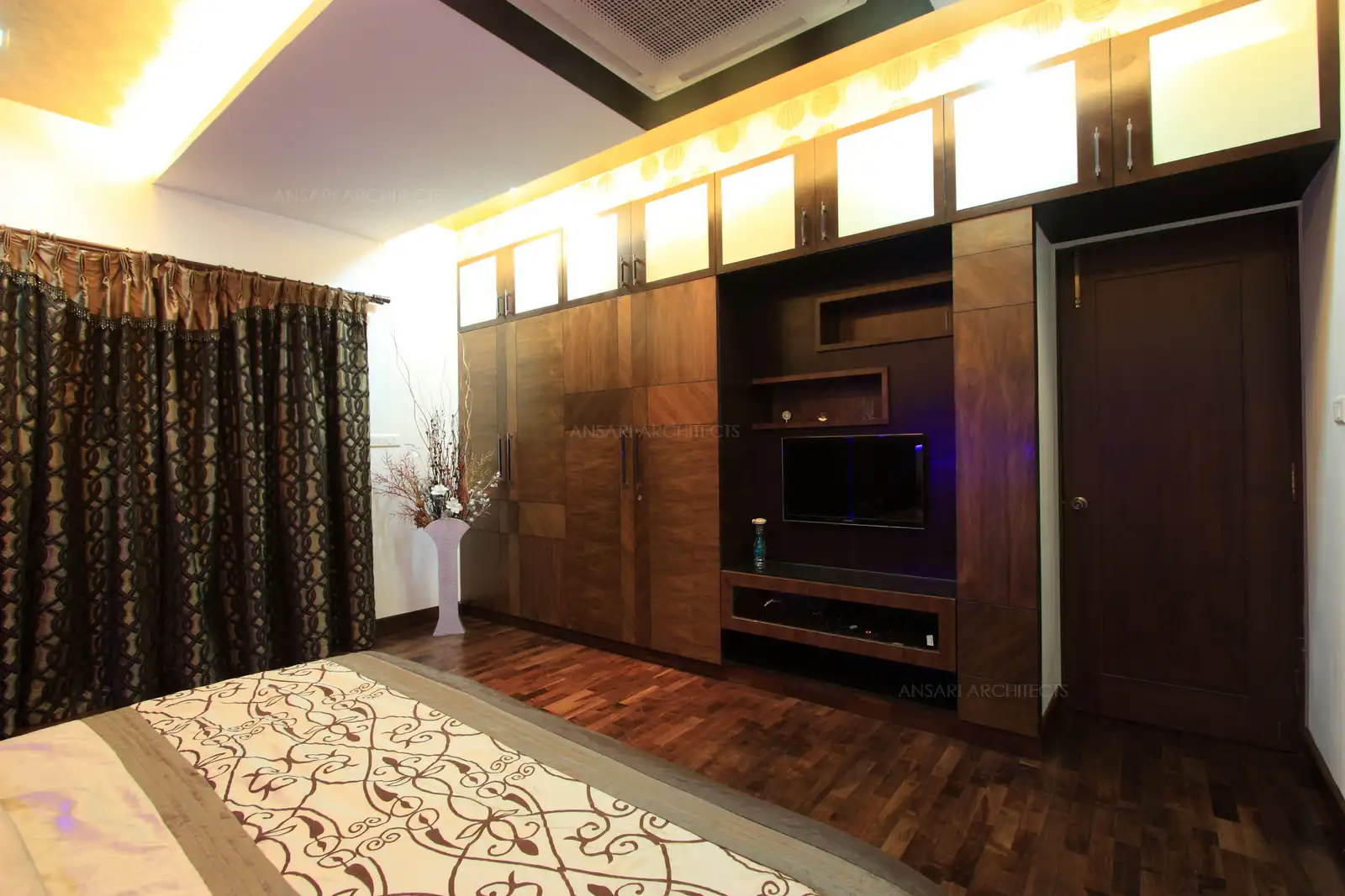 Bedroom-3 in the first floor has rich natural wooden flooring which is matched with the veneers used in the wardrobe.