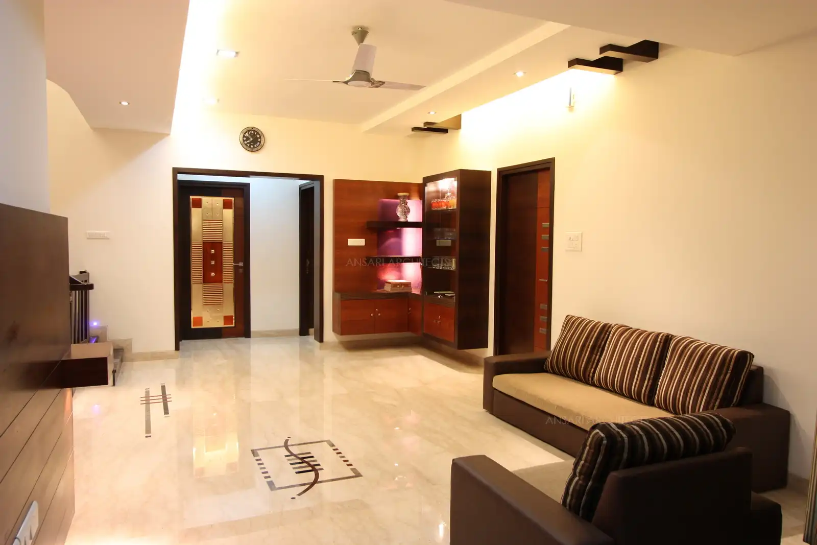 A display unit designed in the family room with bright background and spot lights bright up the corner.