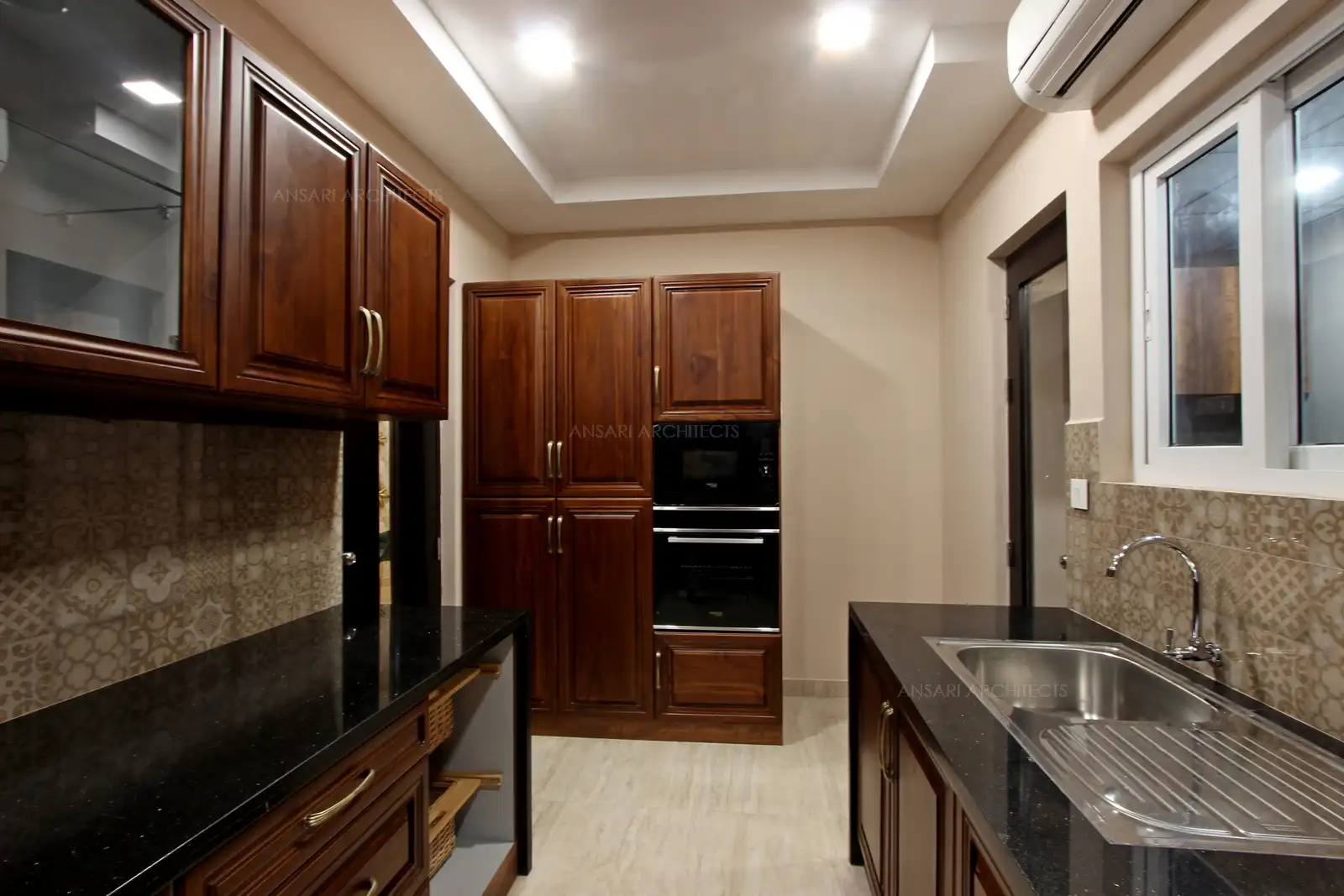 Kitchen renders a antique finish for the entire space, granite top counter, solid wooden cabinets render a warm touch.