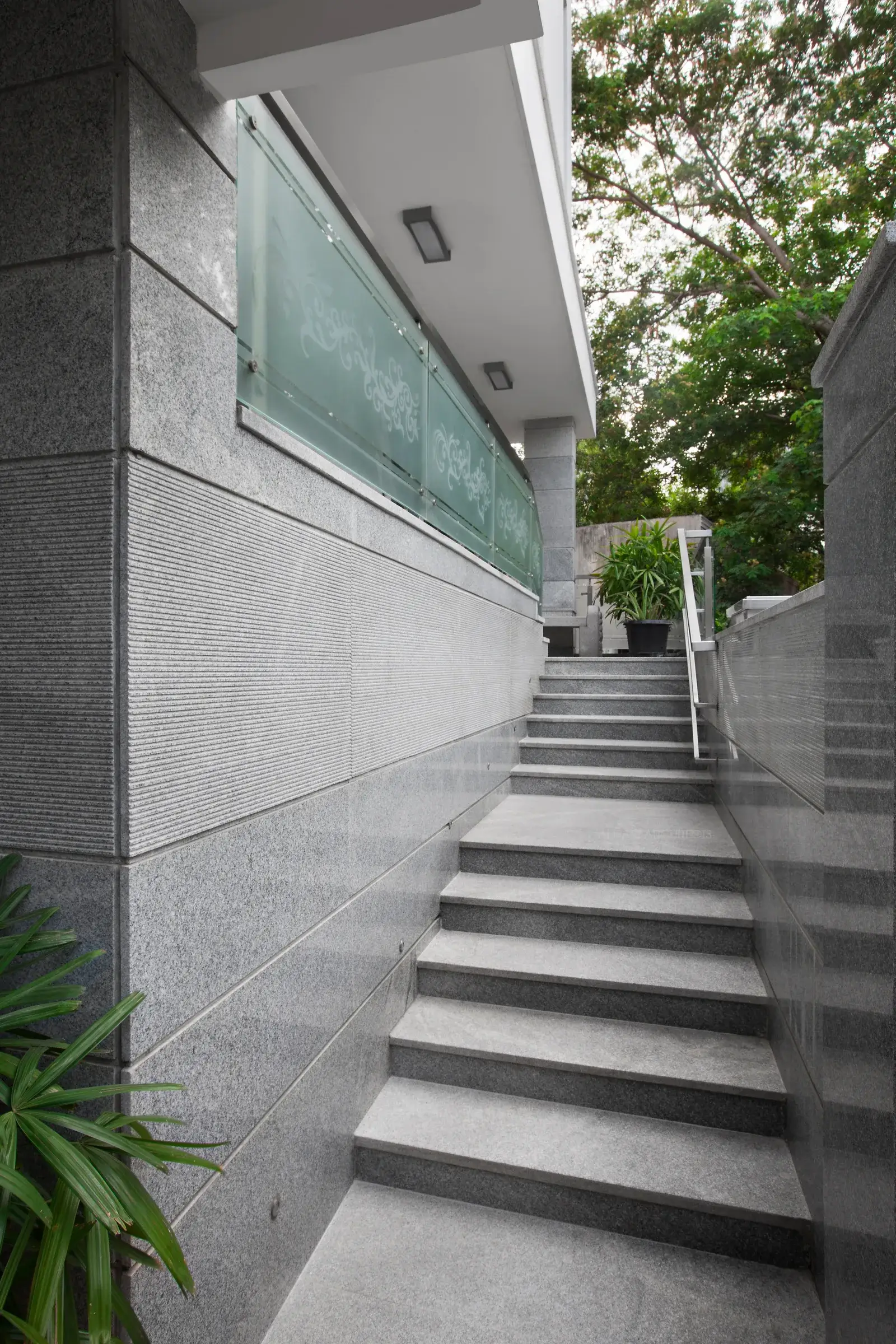 Steps leading to the living room in Semi Mezzanine floor and to the main door.