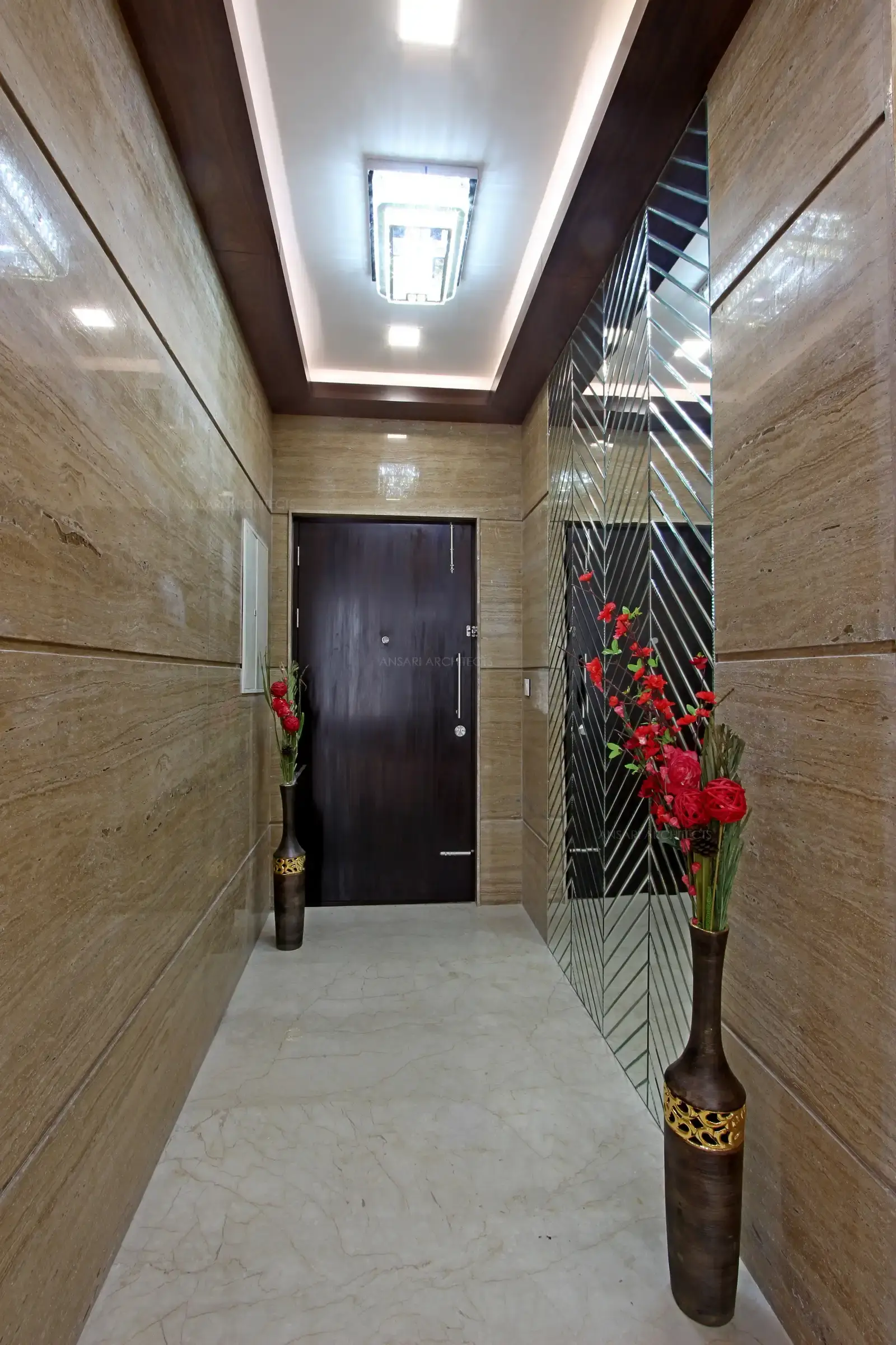 The foyer area is entirely clad with marble, and the ceiling is stud with lights, strip lights create a perfect ambience here.