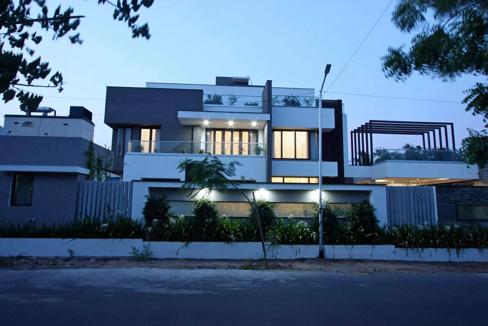 A varied melange of intersting materials are used, stone textures elaborate and provide contrast to the all white exterior along with the dark tone of the wood.