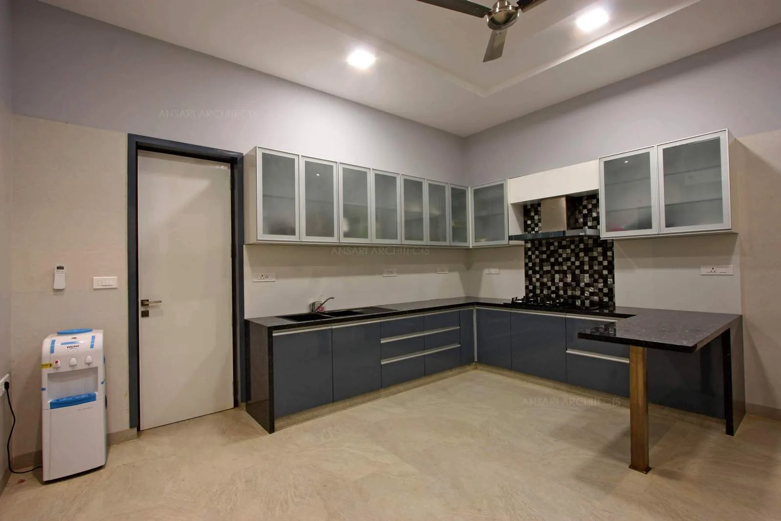 Cascading platforms looks beautiful and trendy, light coloured floor. granite topped counter sets the modular unit apart.