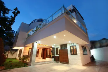 a house with a balcony and a walkway
