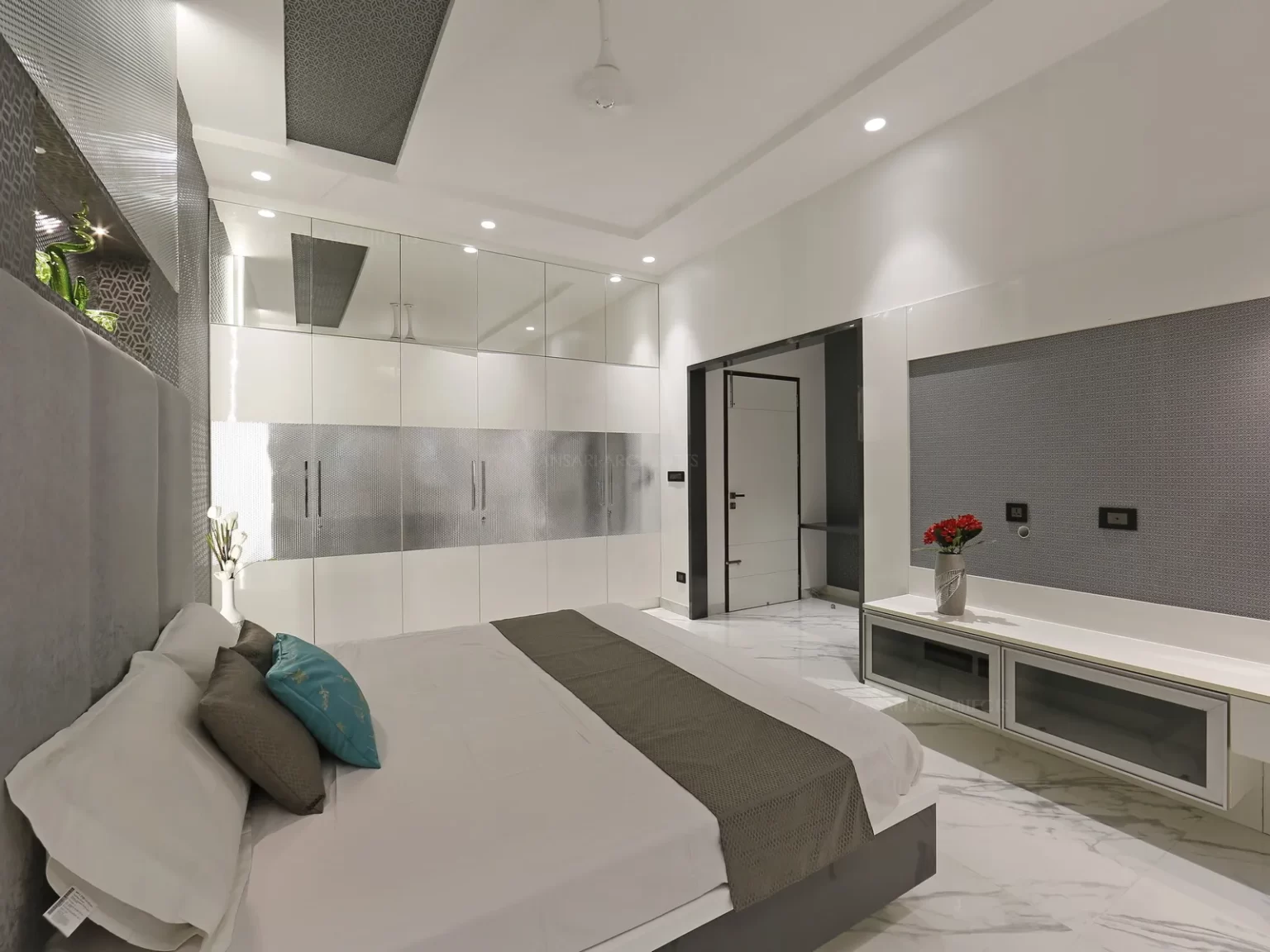 Cove lights act as an accent lighting that emphasizes the design of the headboard and the grey texture collides very well with the headboard.