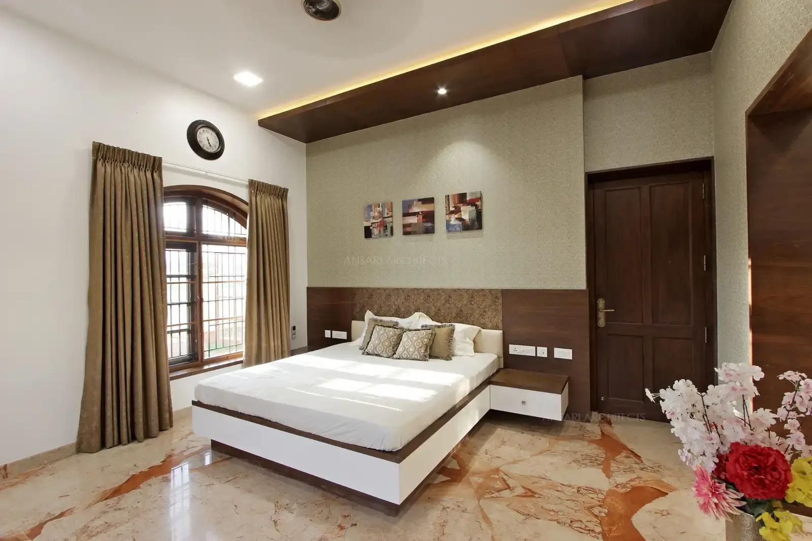 The wallpaper creates a signature material effect for the bedroom.