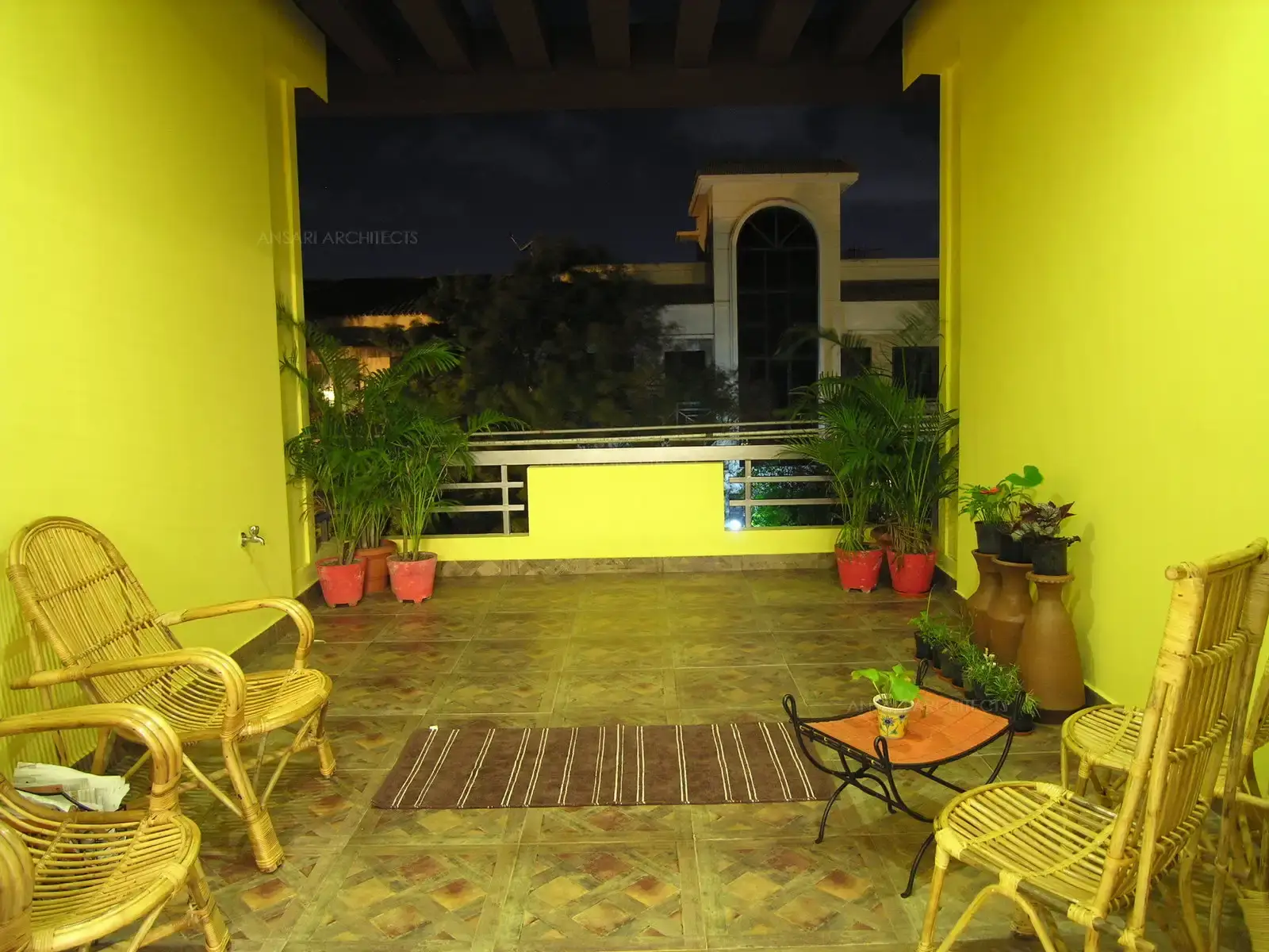Balconies have been painted in bright yellow for a contrast look in the exterior.