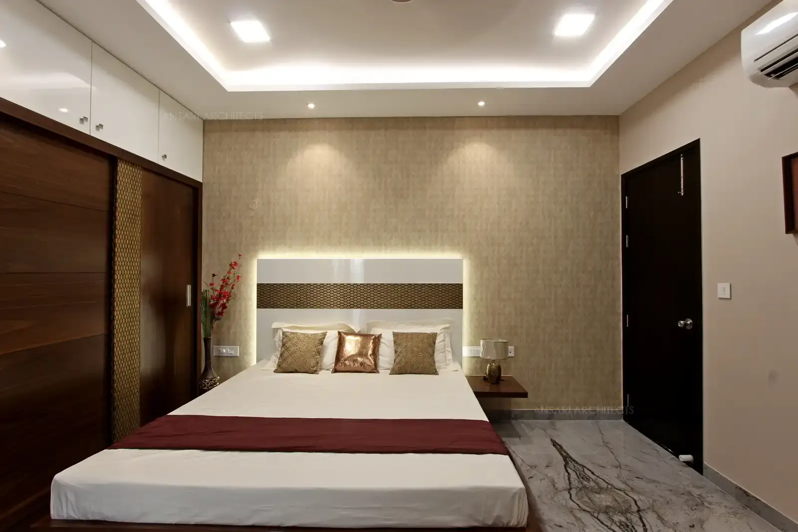 The panelling adds a artistic detail and grandeur to the bedroom, Wardrobe unit cor-ordinates with the same scheme of the bedroom as similar finish to form an interesting composition.