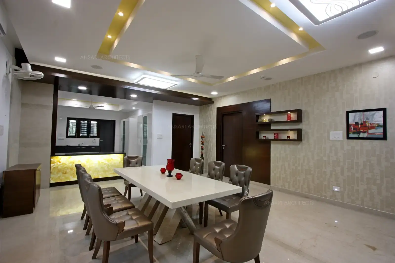 Onyx marble highlights the counter from the dining area with customized marble top furniture with spotlights.