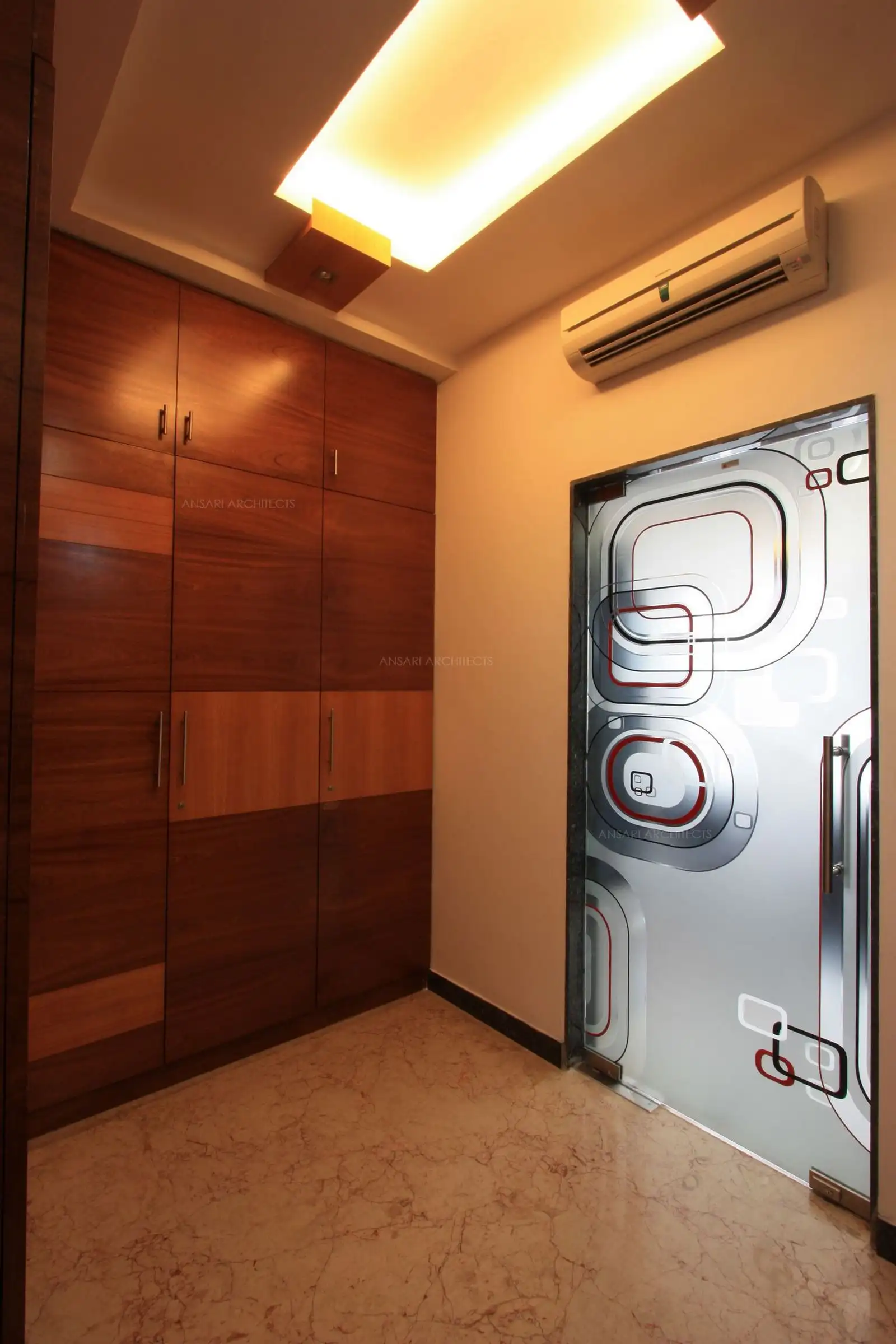 View of Mahagony Veneer finished wardrobe in the dressing room of bedroom-1 in first floor.