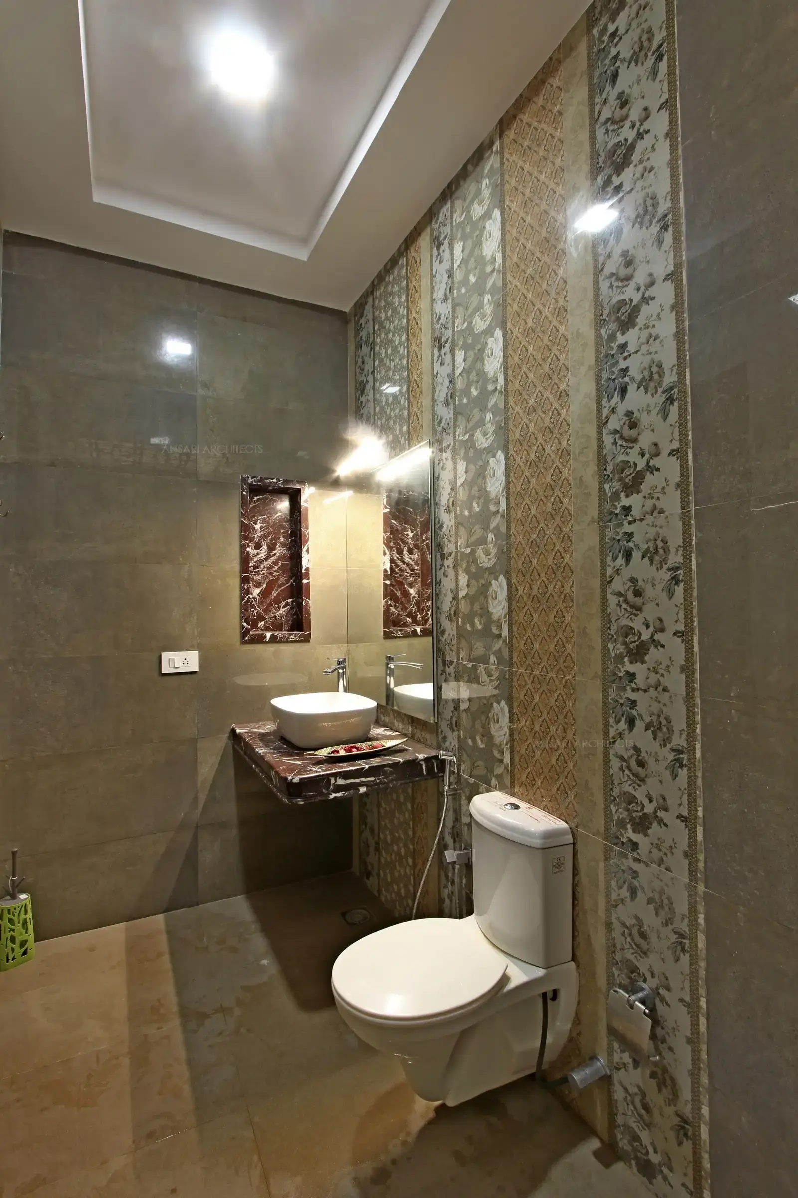The melange wall of brilliant colours and sanitary fittings.