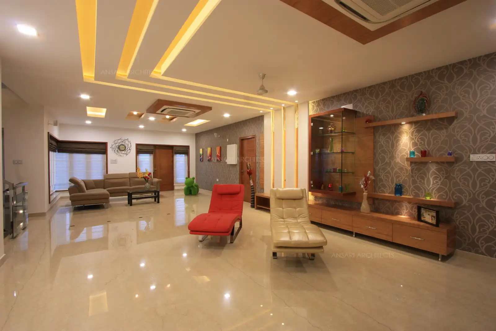 The use of well selected wall paper highlight this large area in the family room in first floor.