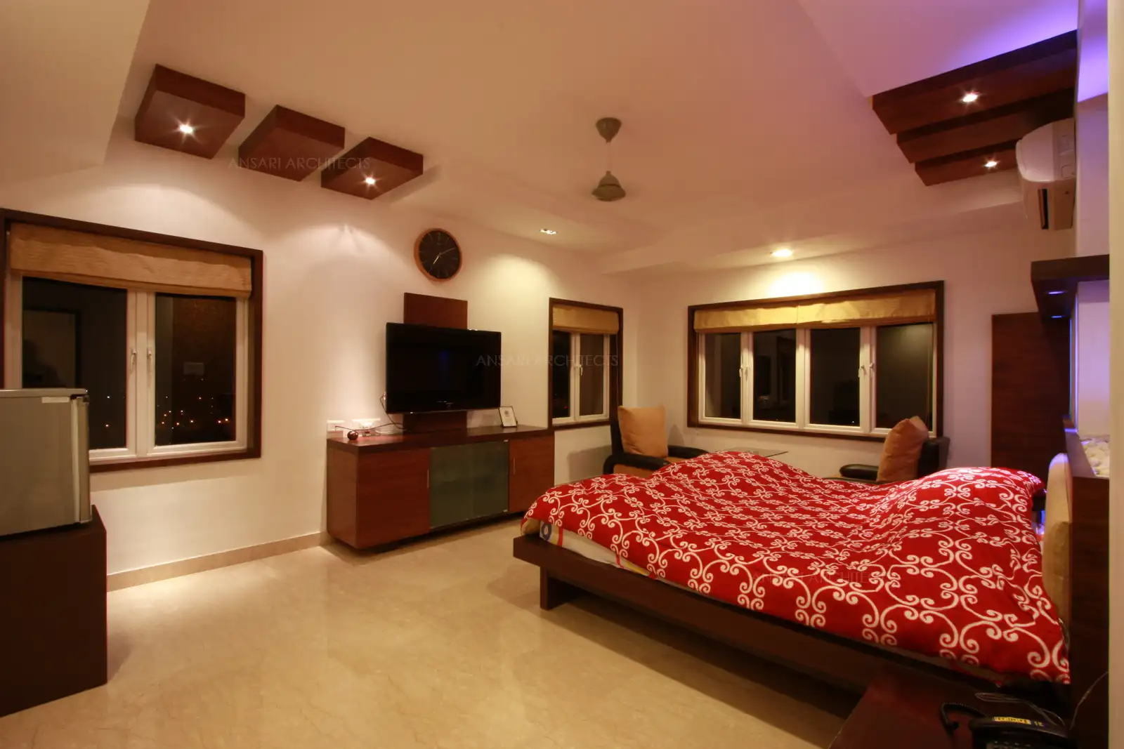 View of master bedroom in the 14th floor with large size windows on both the walls for sea view on east.
