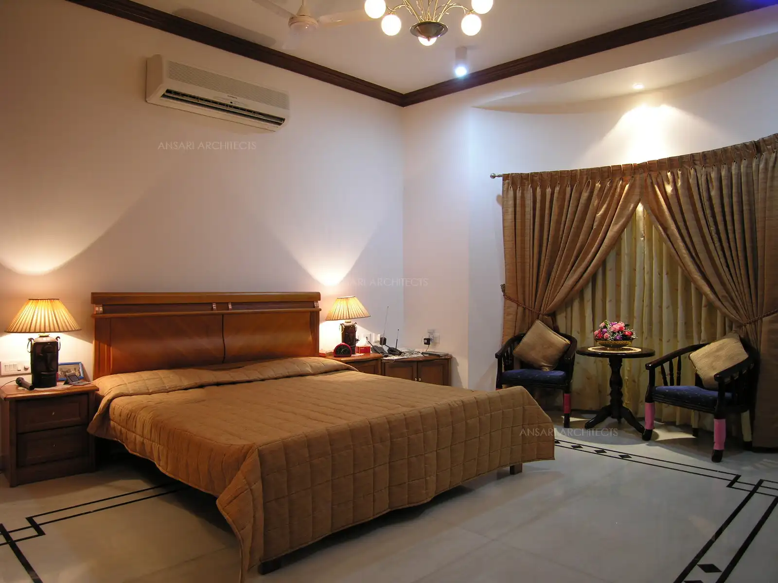The traditional wooden Cot of the master bedroom.
