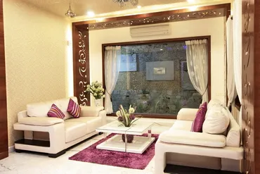 a living room with white furniture