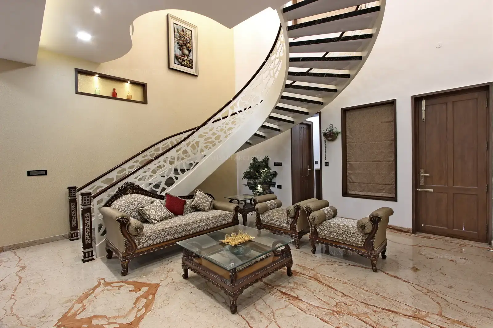 The stairway explores architectural sensibilities which is a organic counterbalance for the space.