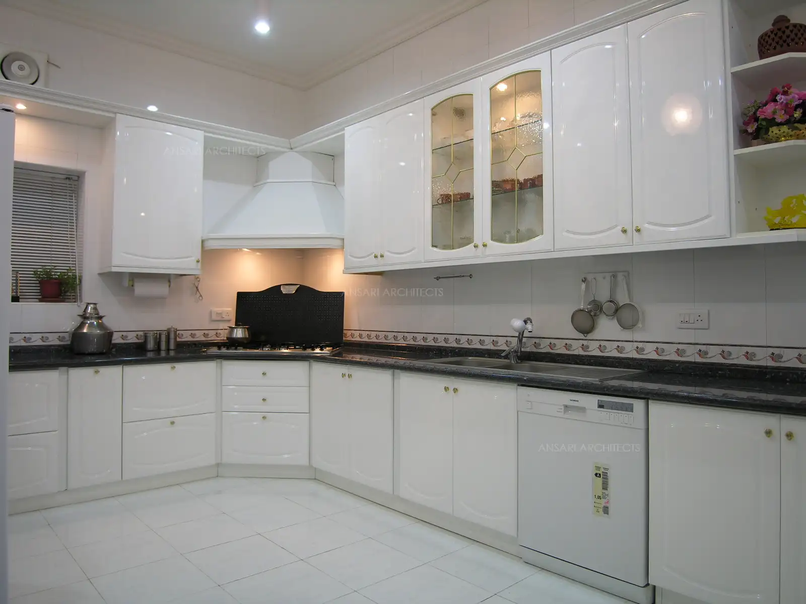 The pure white kitchen, the colour selected by the house owner so that it will have to be kept clean All the times.