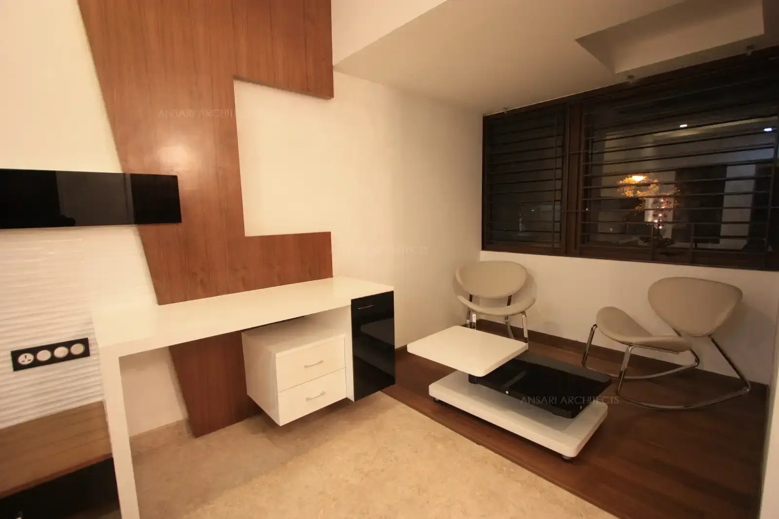 A cosy and comfortable seating area has been created in bedroom-4 which is divided by wooden flooring.