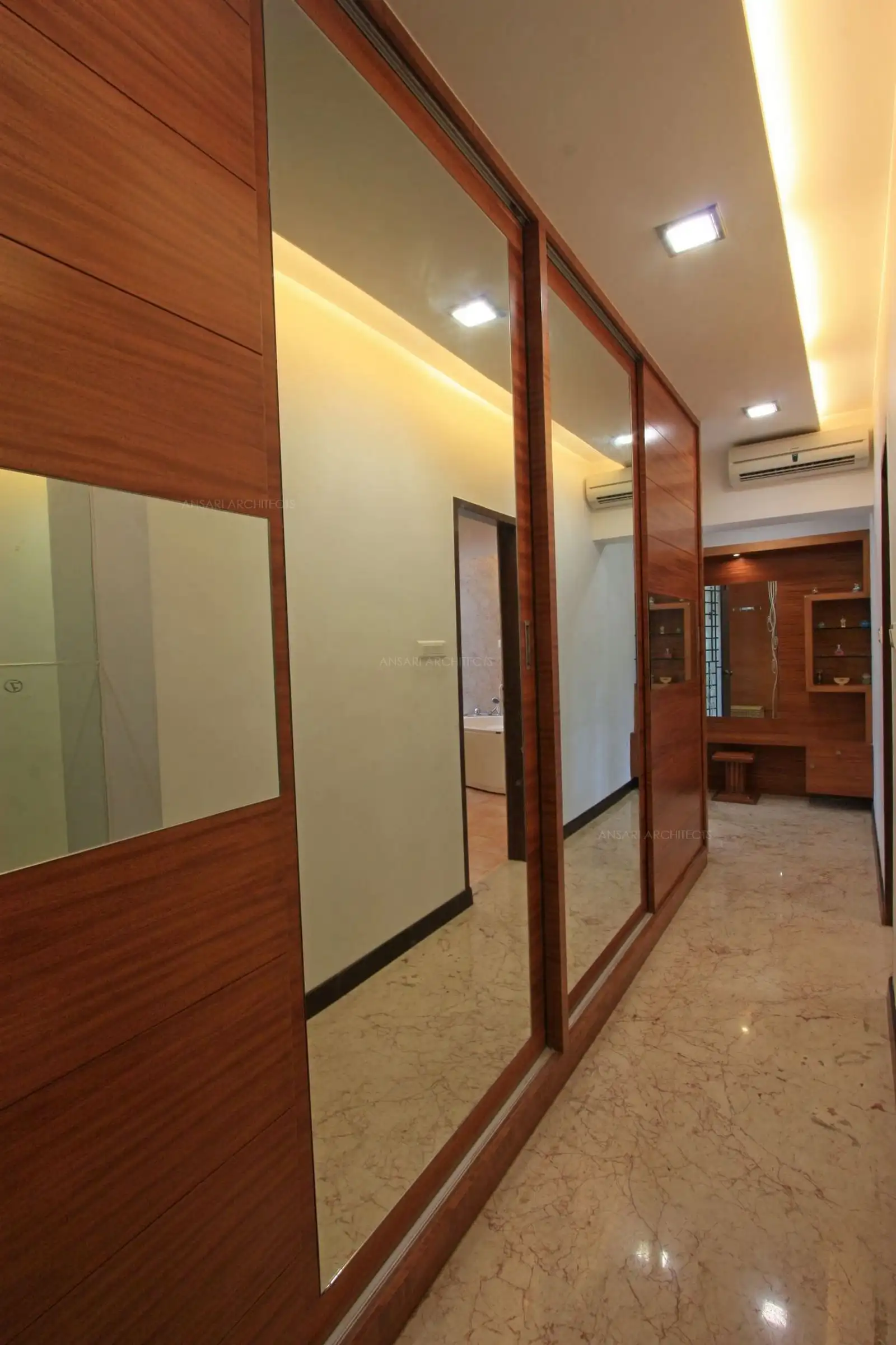The dressing room in the bedroom 2 has a wide wardrobe with mirror sliding door to a wider look.
