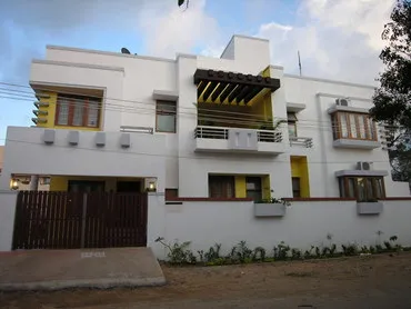 a white building with yellow trim