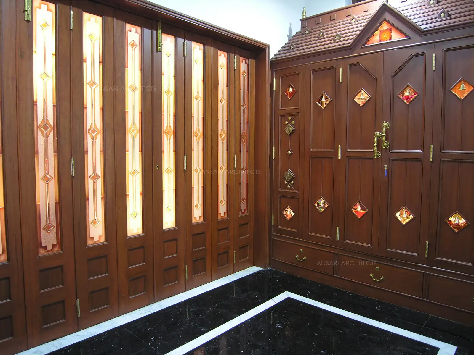 The Pooja room with dark Italian marble flooring.
