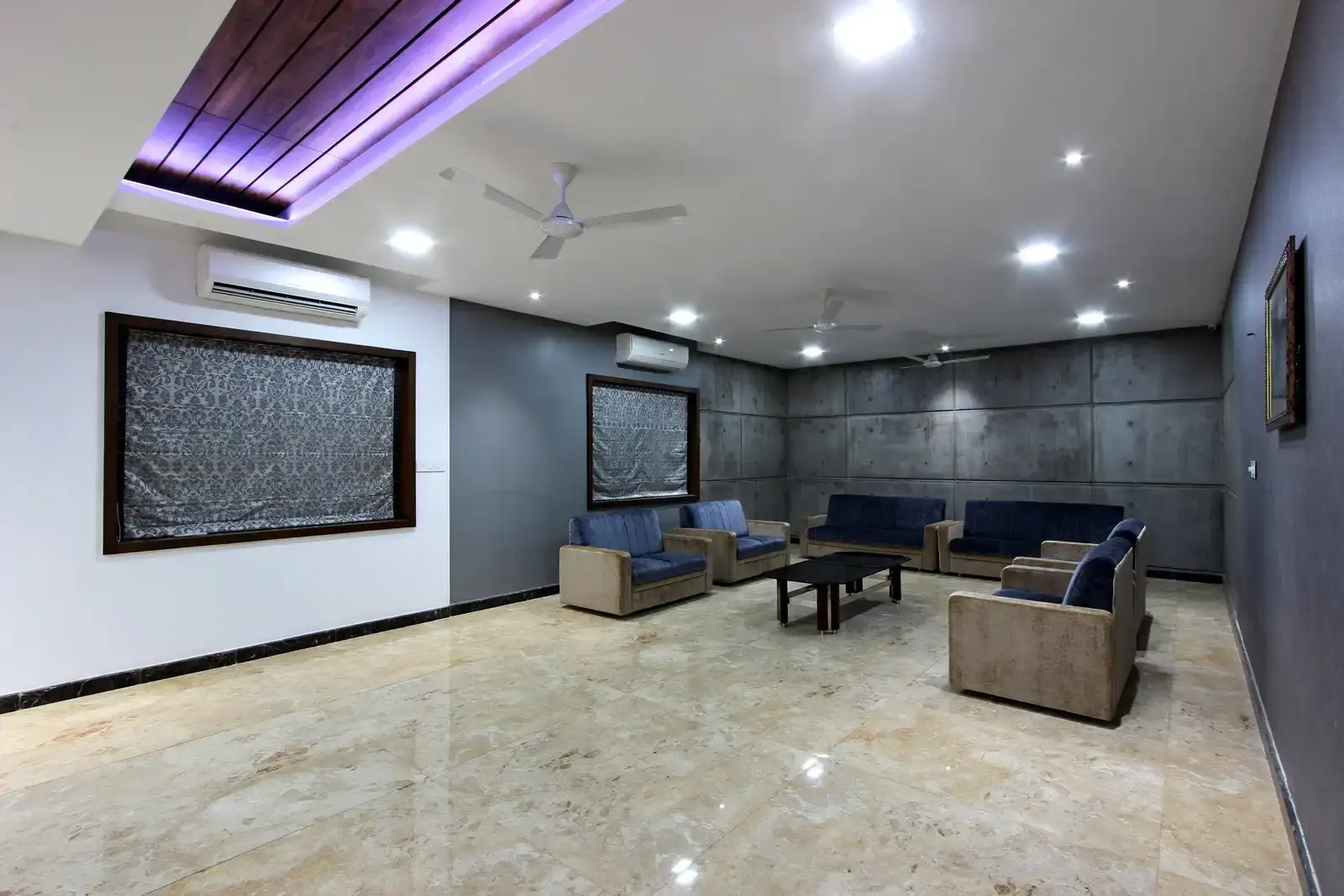 The walls add a luxurious look here with panelled strip wood ceiling and lighting responds to the colour of the walls creates a sensual space.