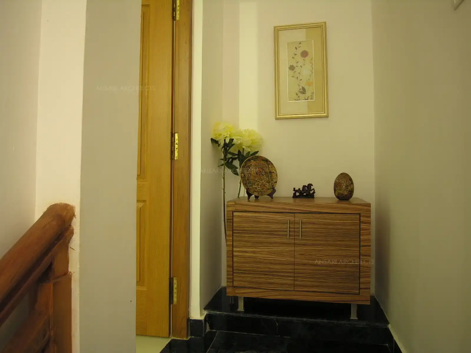 Corner of the passage was turned into a focal point with a simple table and treasured artefacts and decorative flowers.