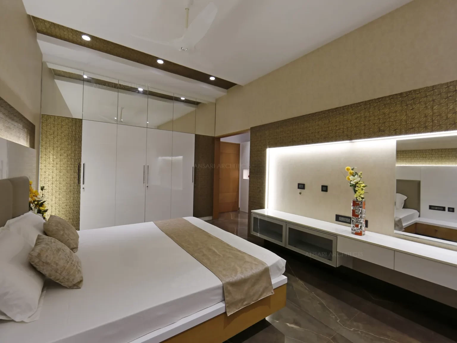 The golden linings all over the bedroom provides a serene environment , Mystical accents of solid wooden doors and the linings exudes exaggerated luxury.