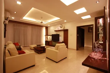 a living room with a tv and couches