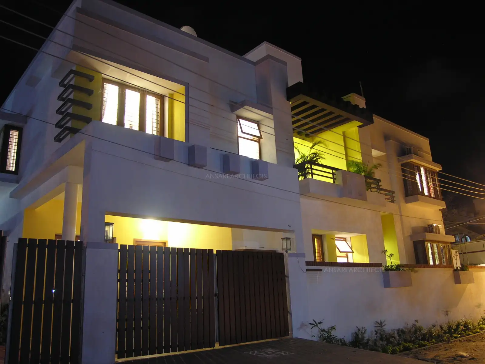 Night view of the house with artificial lights.