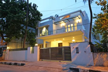 a house with a gate and trees