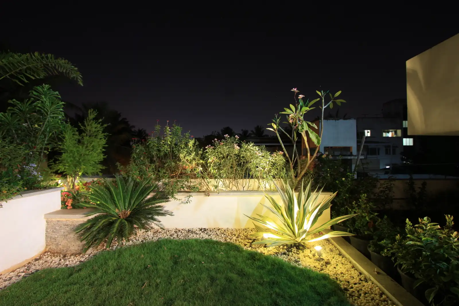Use of lots of plants and shurbs bring greenary and fresh air to the environment as well as acts as a privacy factor in this terrace garden.