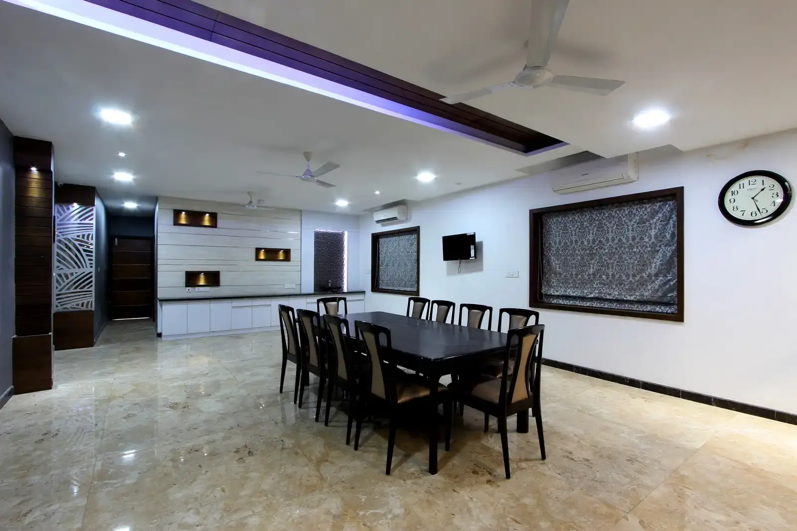 The unifying characteristic is the recessed false ceiling on the top of dining area it well connects the family space and the dining area adding layers to illumination.