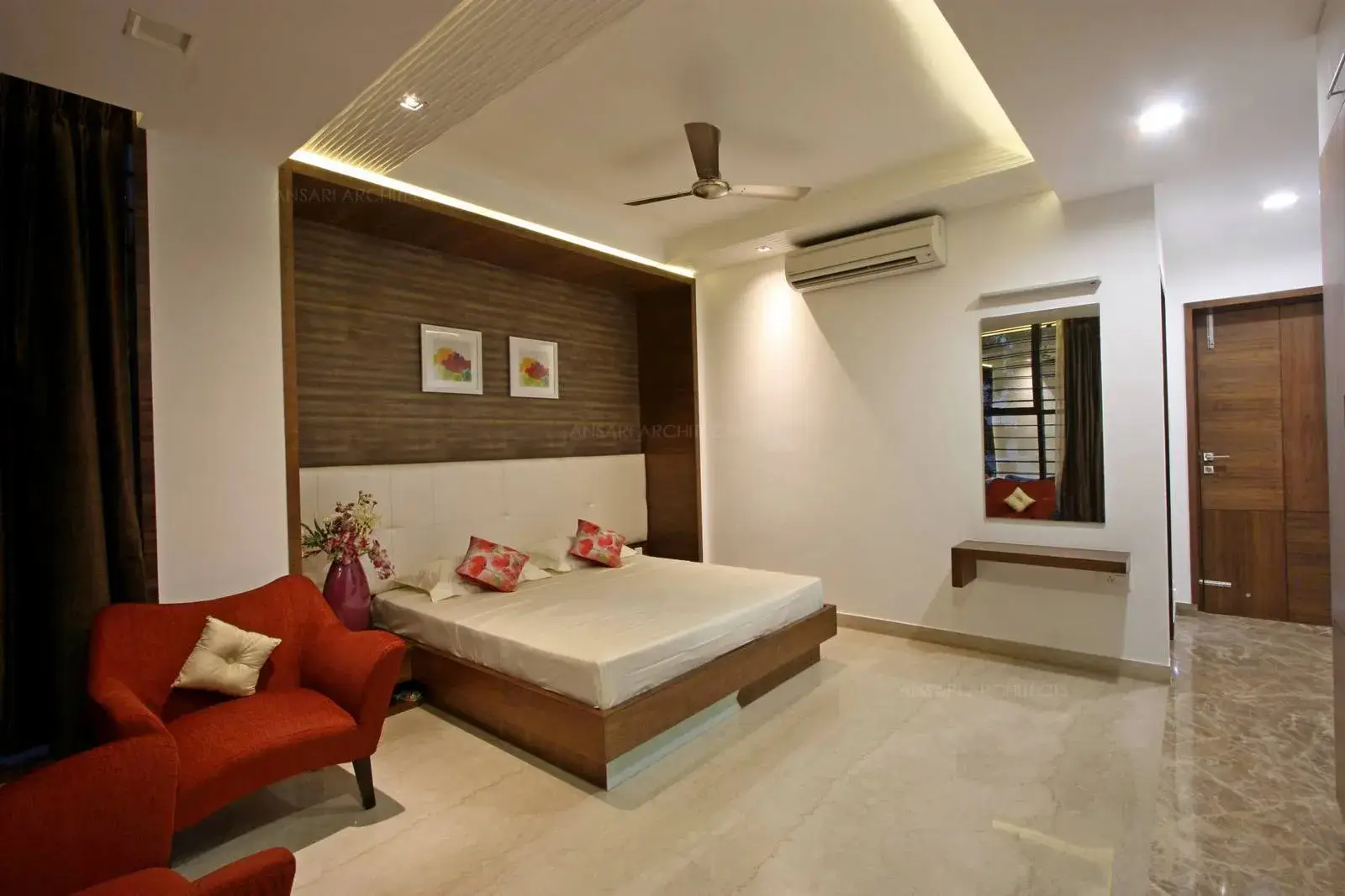 The headboard area is recessed for the best interior asset with veneer panelling for a solid look adding on to create a focal point .