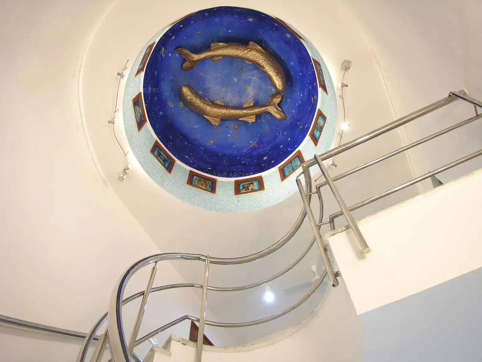 The dome which is on top of the curved staircase is fixed with a specially made artwork depicting the zodiac sign of the house owner.