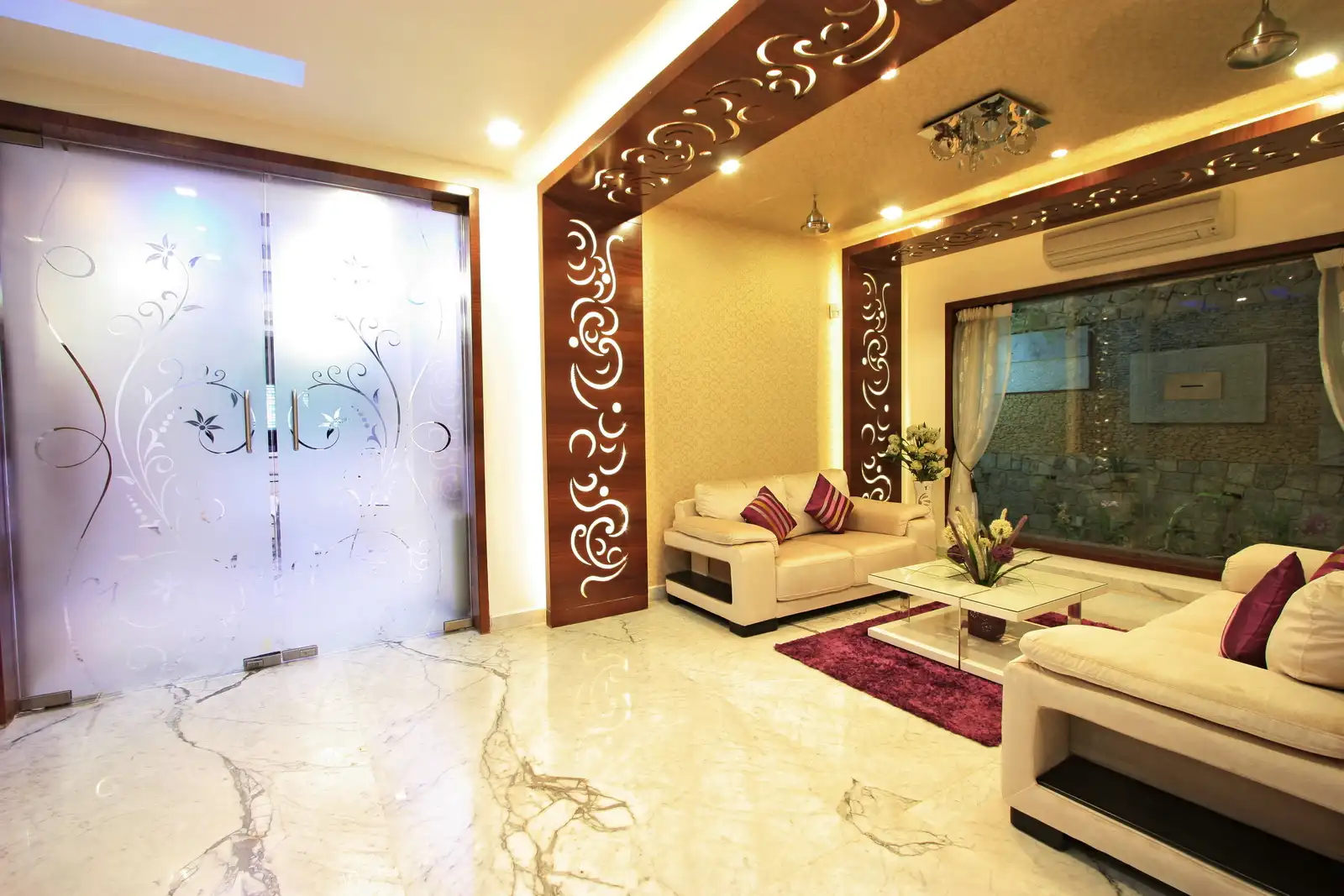A large glass door with similar floral motifs in the drawing room opens up to the rest of the main areas in the house.