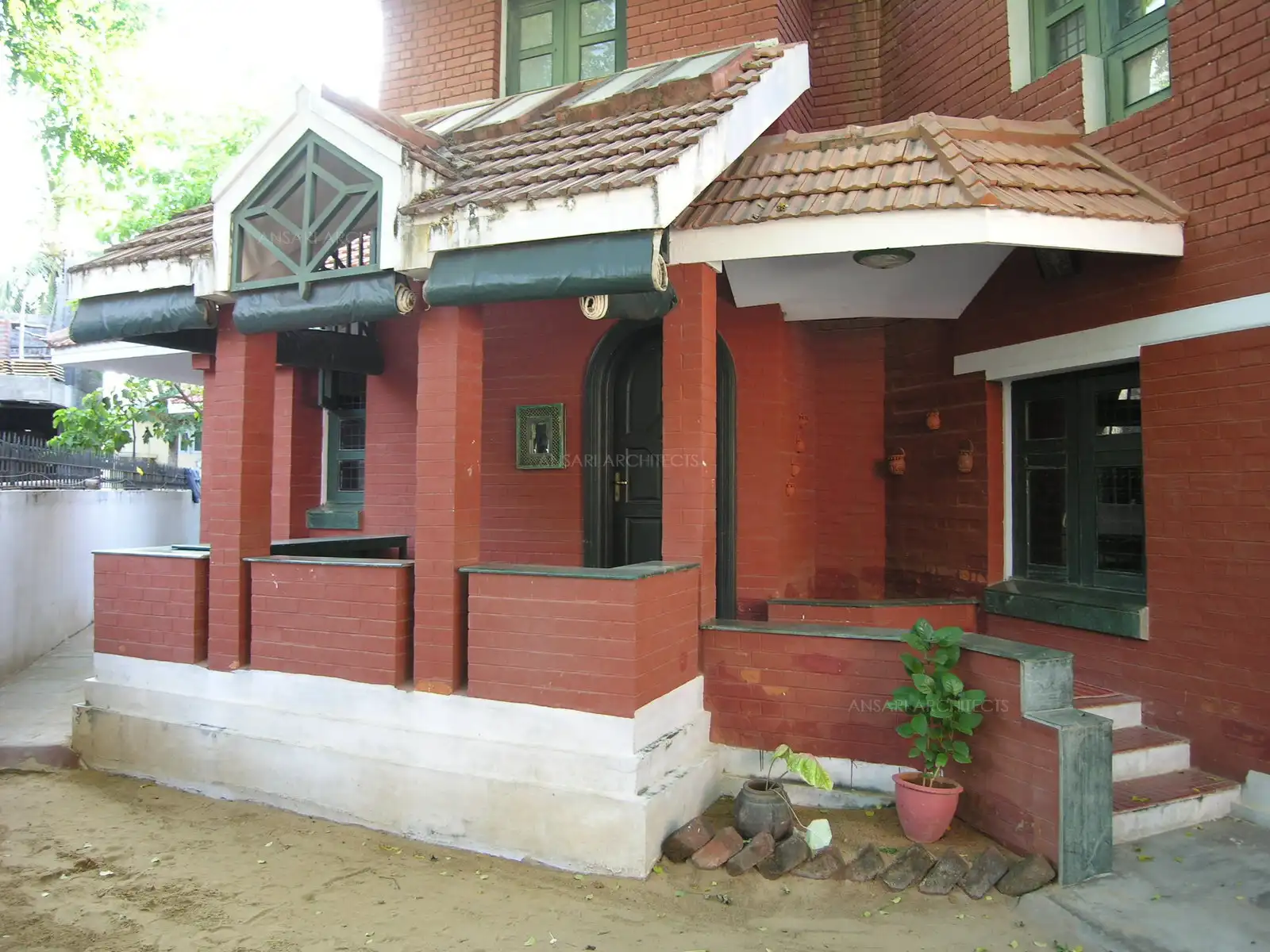 Veranda in the front with rustic natural setting.