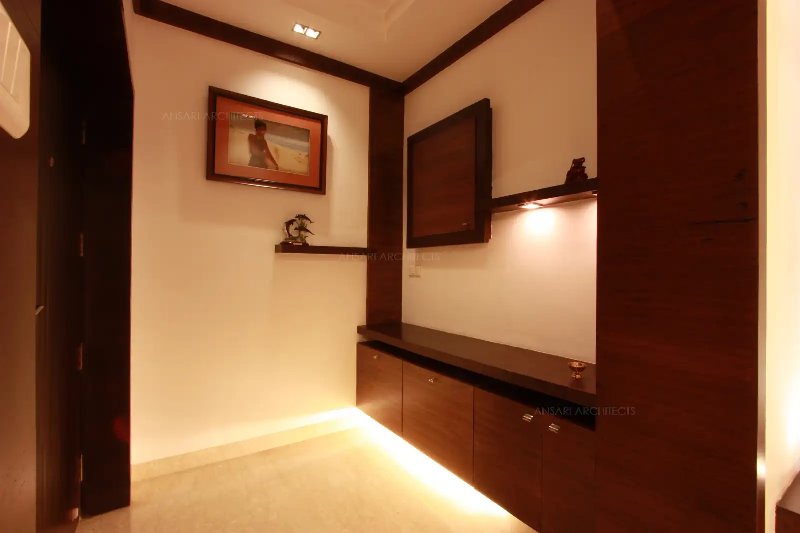 Foyer area in the front has shoe rack designed with a platform above which acts as a seating.