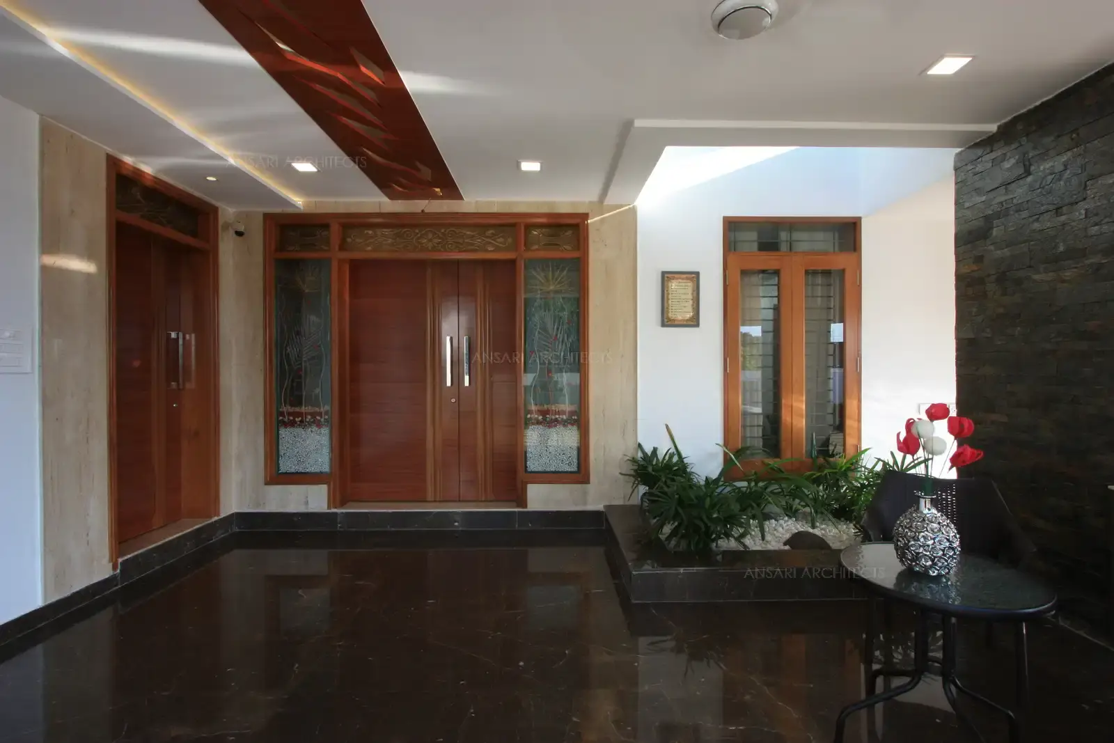 Main entrance facing the north has decorative glass in combination of rich wood.
