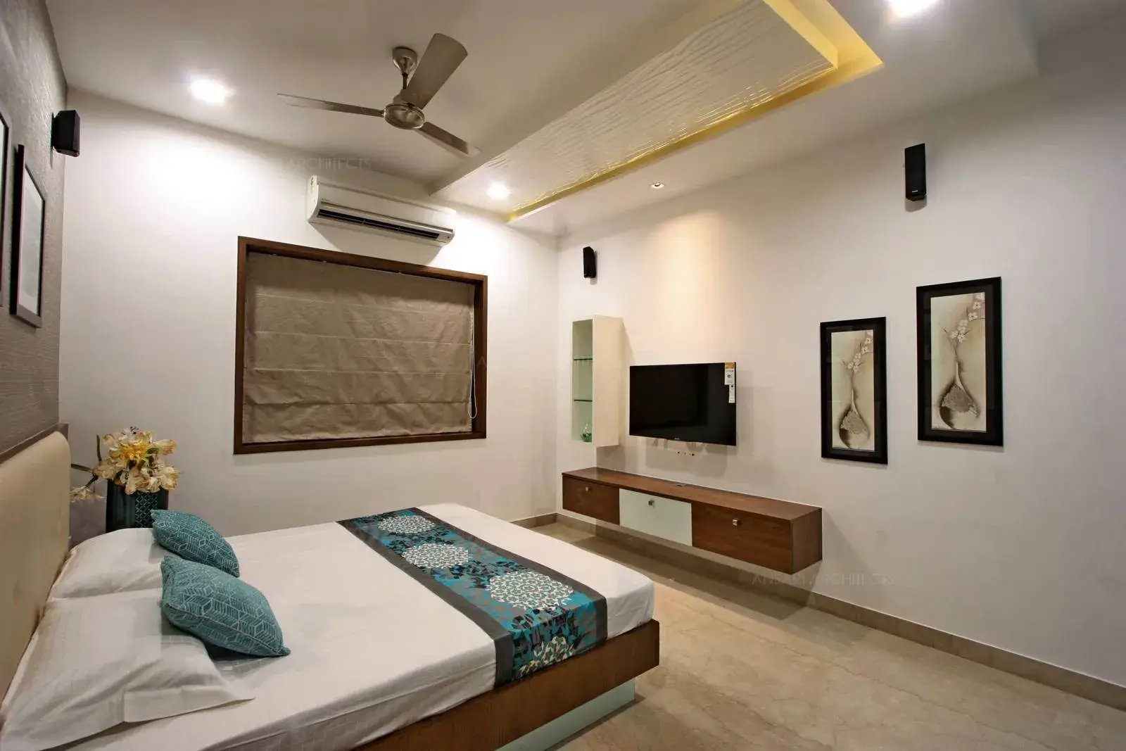 The bedroom has composed colour scheme well grounded with other furnishings of the space.