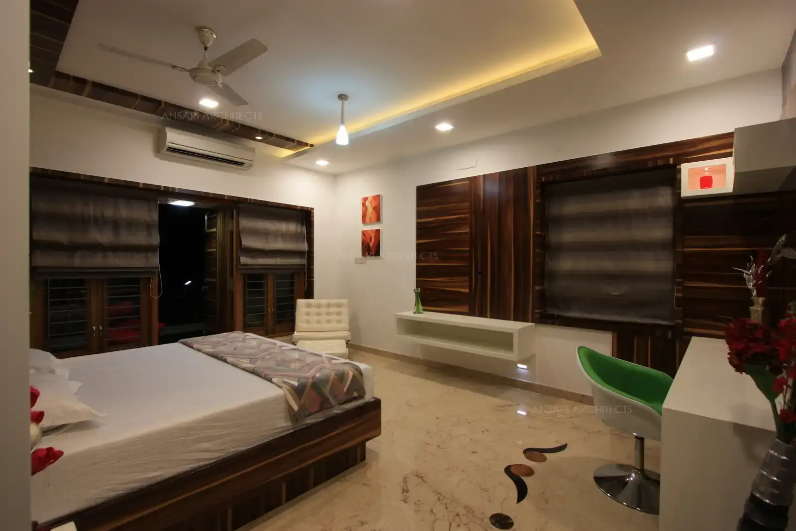 The son's bedroom in the first floor has been finished with bold shade of veneer for a masculine look.