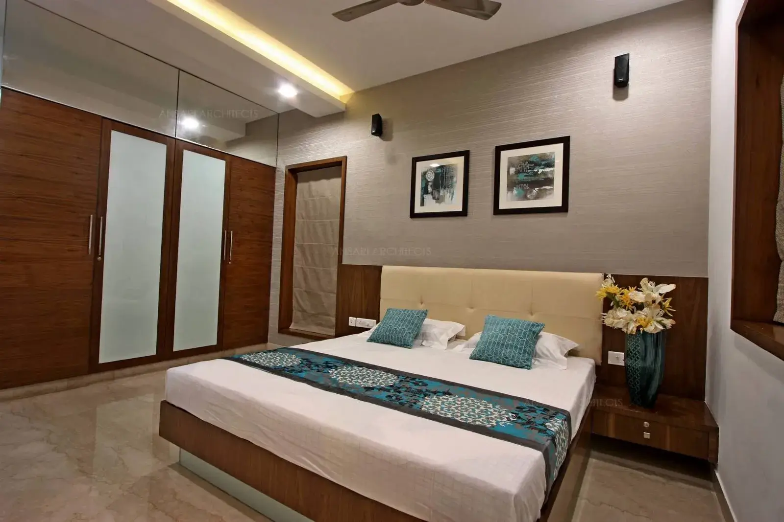 The choice of muted colours and gypsum ceiling enrich the modern look with inbuilt wardrobes adding to functionality with aesthetic sense.