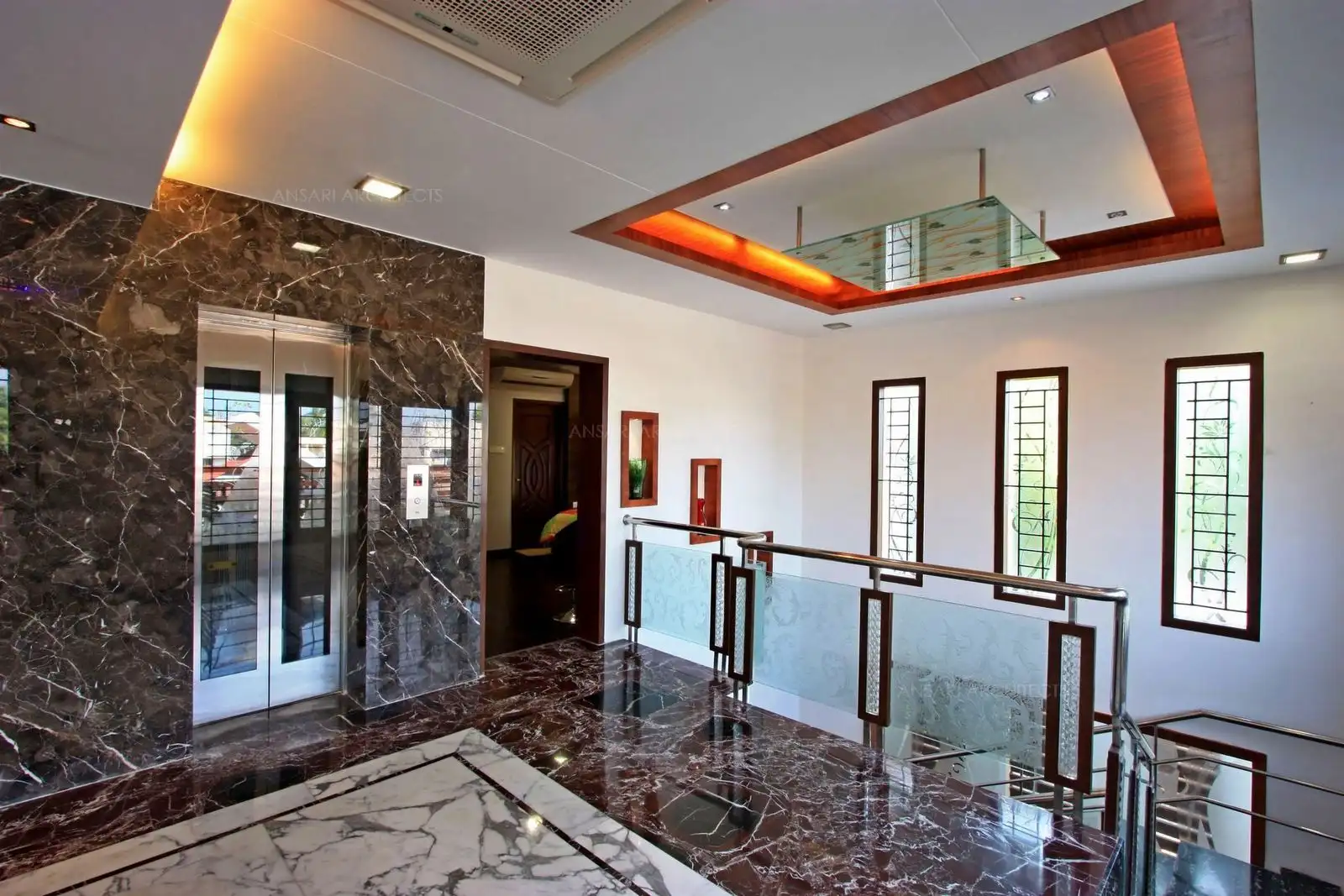 The common area in the second floor has dark colour lavento marble cladding in combination with stauario marble for a royal look.