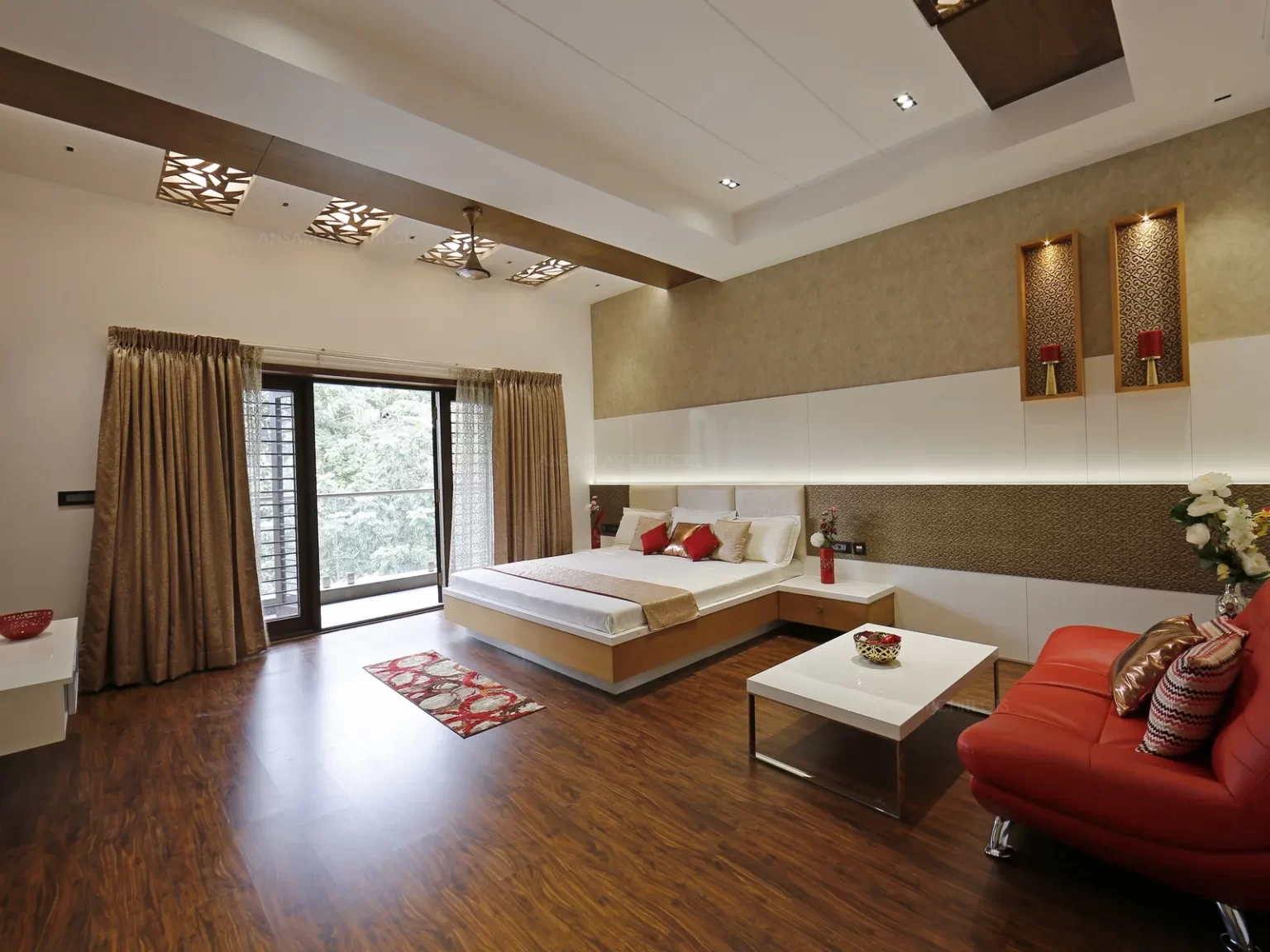 The wall niches with vibrant designs with classic wood tone adds a new charming fusion with the headboard having different tones of light and dark textures acts as a focal point.