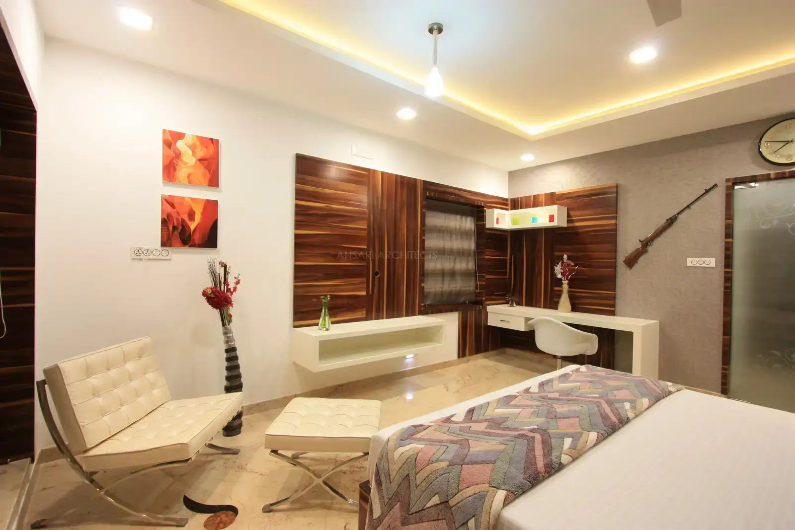 White furnitures in contrast to dark shade of veneer brightens this son's bedroom in first floor.