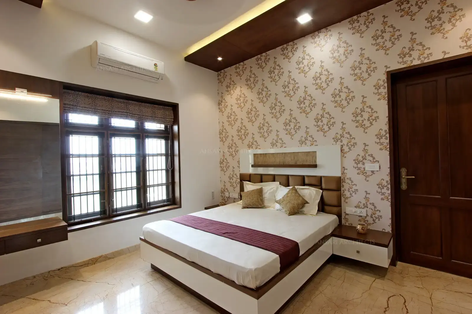 The windows provide natural light and cove lights highlight the false ceiling