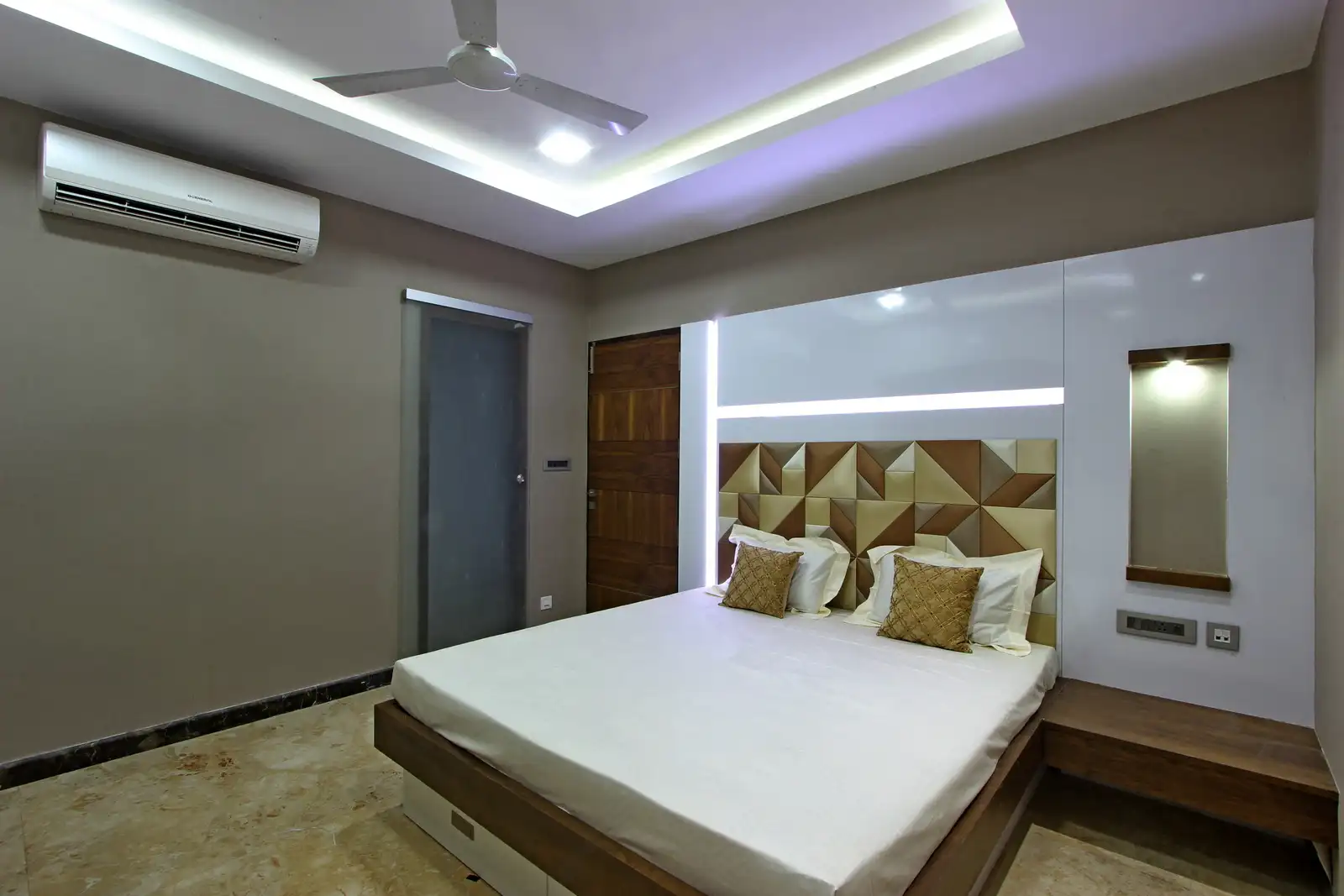 The false ceiling is highlighted with strip lights with well integrated flooring.